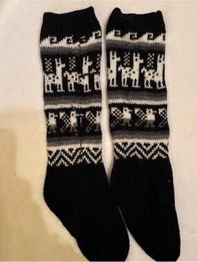 Hand knit in Peru or Bolivia black and white slipper socks made of Alpaca wool.